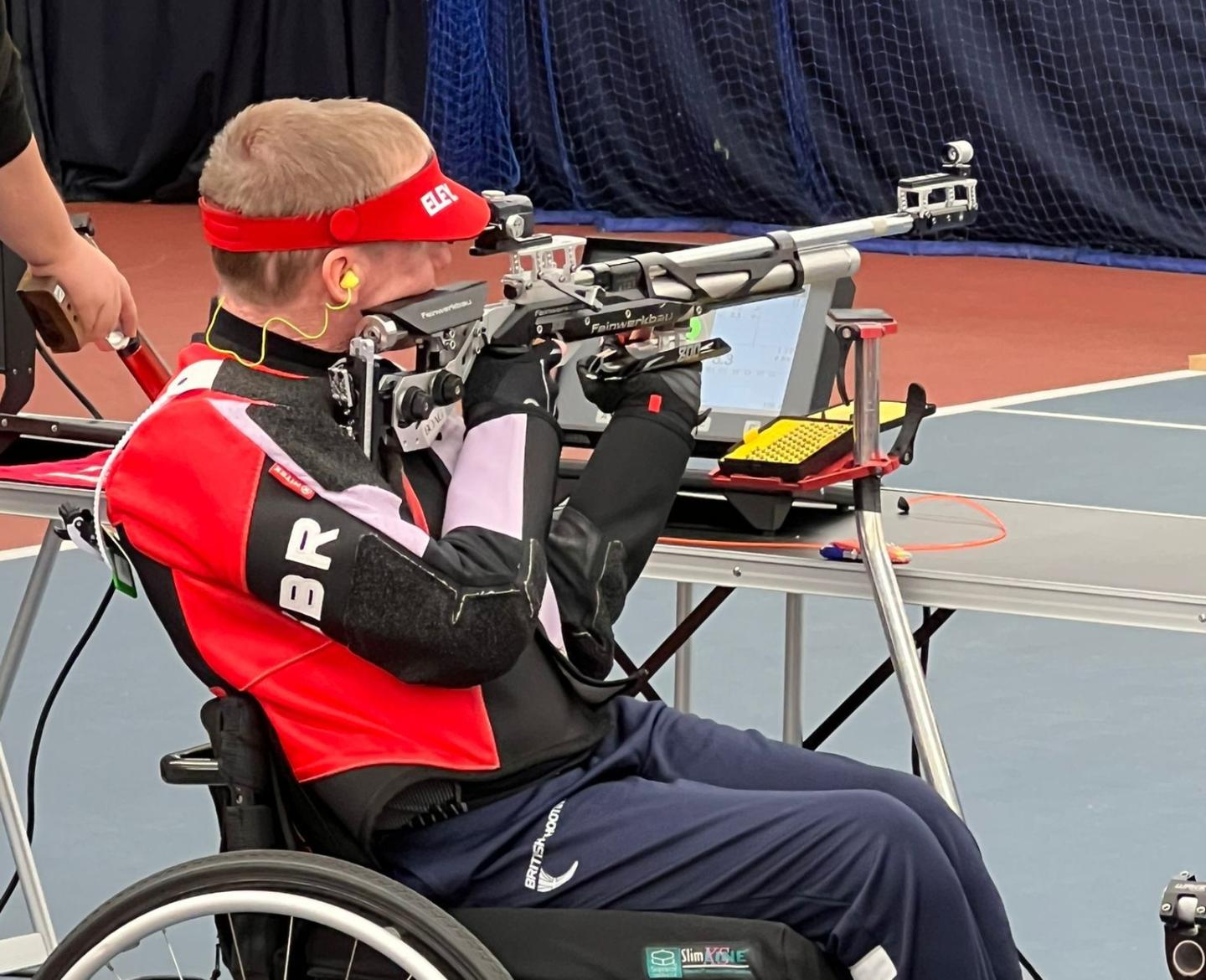 Paul Barker sat in his wheelchair aiming his rifle at a target