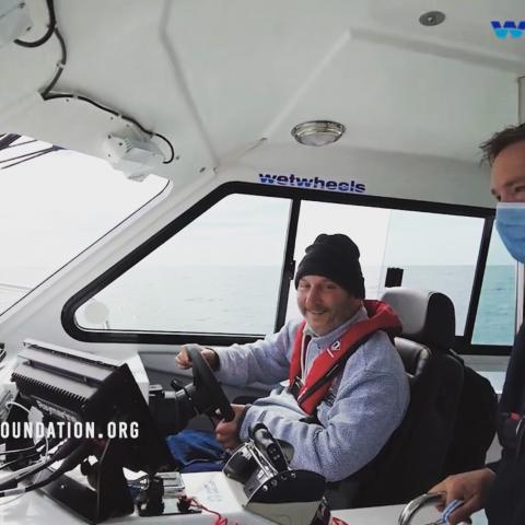One of our passengers taking the wheel of our 650hp power boat.