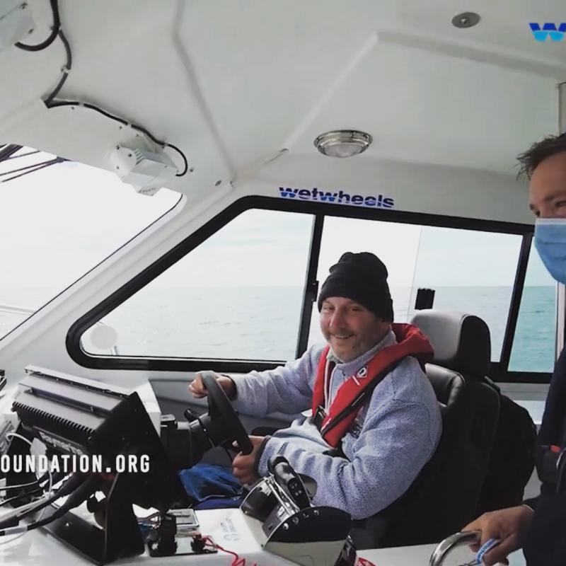 One of our passengers taking the wheel of our 650hp power boat.